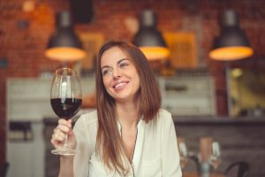 Woman holding a glass of wine