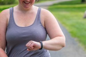 Woman checking heart rate from jogging