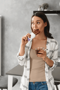 Woman eating chocolate