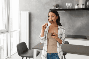 Woman eating chocolate