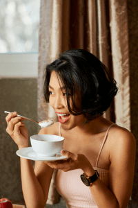 Woman eating Yogurt