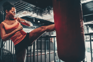 Woman does kickboxing exercises