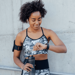 Woman checks fitness watch for calories burned